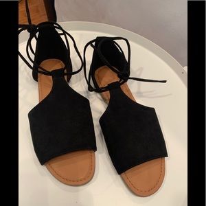 - Black suede sandals